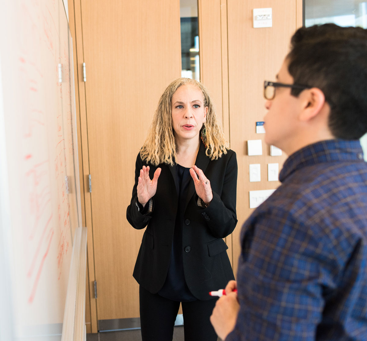 woman-standing-near-whiteboard-square